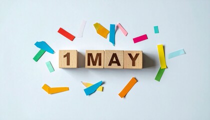 Wooden Blocks with Date 1 May. Calendar for birthday or anniversary on solid colored background with confetti
