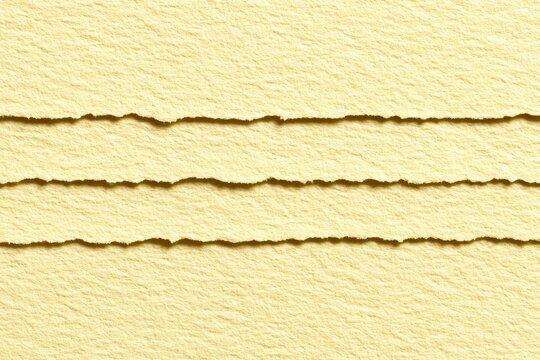 Pale yellow paper with horizontal, torn edges