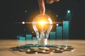 Business idea light bulb and money with graph concept for financial investment and success plan strategy