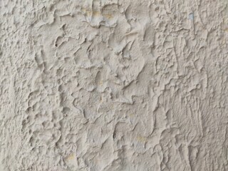 A rough popcorn ceiling with a bumpy, textured white finish, an abstract background for construction visuals or minimalist design projects.