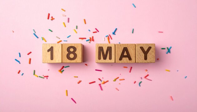 Wooden Blocks with Date 18 May. Calendar for birthday or anniversary on solid colored background with confetti