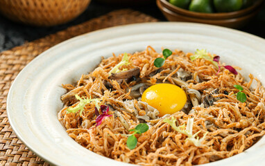 Deep-fried shredded mushrooms with runny egg yolk,the Dai nationality cuisine,from Xishuangbanna,Yunnan,China