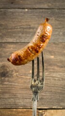 Grilled sausage on fork