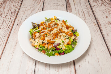 Roasted sweet potato salad with canned tuna, corn, fresh cilantro, and lime, with an avocado and natural yogurt dressing