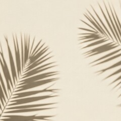 Obraz premium Beige background with shadows of palm leaves, creating a serene and natural aesthetic.