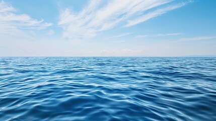 Obraz premium Serenity Unbound: Breathtaking Scene of Blue Sky and Vast Sea – A Clear, Azure Sky Stretching Endlessly Above a Calm, Deep Blue Sea, Where the Horizon Blends Sky and Water into a Soft Line