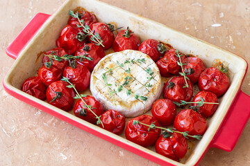 Baked brie cheese with tomatoes and thyme. Healthy food. Vegetarian food.