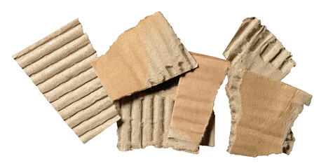 Heap or stack of isolated torn pieces of brown corrugated cardboard with texture and fine details, transparent png background design element