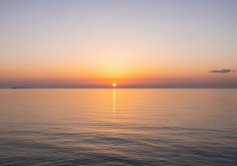 Obraz premium Peaceful ocean horizon with vibrant golden hour light