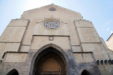 Santa Clara (St. Clare) church, religious complex with monastery, tombs and museum, Naples, Italy.
Fa&ccedil;ade in Gotico Angioiano style of the basilica (1313&ndash;1340) partially destroyed during World War II.