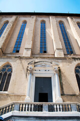 Religious complex of Santa Clara (Saint Clare) with basilica, monastery, tombs and museum.
Lateral tufa brickwork fa&ccedil;ade of the basilica with the entrance of nuns' choir, Naples, Italy.