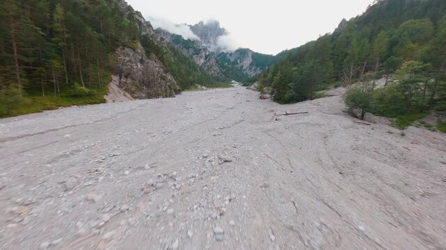 Aerial first person view of limestone river valley in Ges&auml;use, dry riverbed
