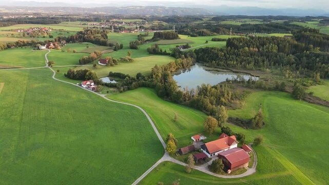 4K drone footage of lush green rolling hills and forests in scenic Bavarian countryside, Germany, perfect summer landscape