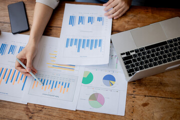 Organized stack of business documents and paperwork on office desk, representing planning, financial analysis, management, efficiency, responsibility, and deadline-focused professionalism.
