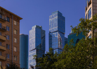 Fototapeta premium High-rise buildings and skyscrapers on a sunny summer day.