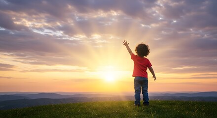 Child standing on a grassy hill reaching toward the rising sun, symbolizing healthy future