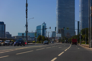 Construction of buildings and high-rise cranes against the sky and city street © Kozlik_mozlik