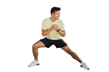 Individual performing a flexibility exercise in a light workout outfit at home for fitness improvement and health enhancement