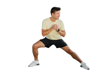 Individual performing a flexibility exercise in a light workout outfit at home for fitness improvement and health enhancement
