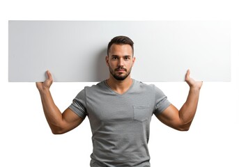 Young adult showcasing blank placard against a clean white backdrop in studio setting