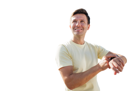 Smiling man checking watch while enjoying, isolated transparent background