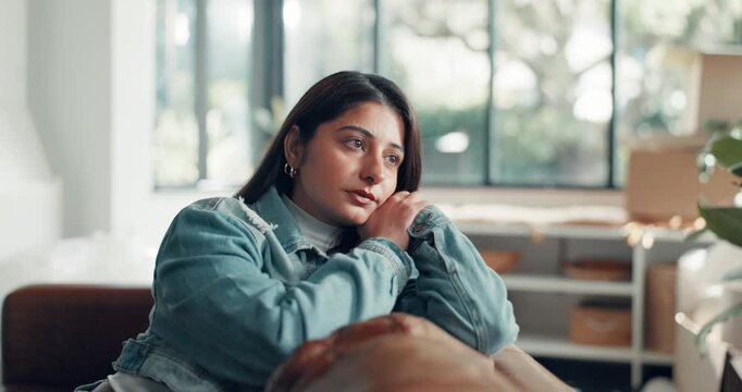 Woman, thinking or anxiety on sofa with tension, expecting news or concern for career. Worry, unemployed person or frustrated in home with stress, financial strain or answer for job application.