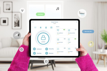 Person holding tablet with smart home security lock application