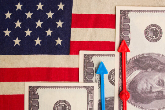 Dollars and growth charts against the background of the US flag
