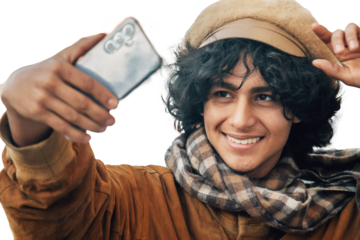 Young man with mobile phone and winter clothes isolated, cut out