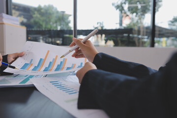 Team of business people working together in the meeting room office,
teamwork background charts and graphs banner, double exposure successful teamwork,business planning concept.