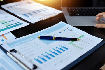 Team of business people working together in the meeting room office,
teamwork background charts and graphs banner, double exposure successful teamwork,business planning concept.