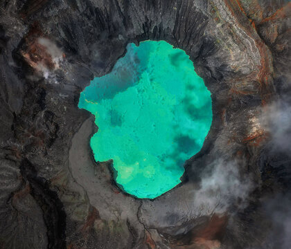 Aerial drone view of green volcanic crater lake inside Po&aacute;s Volcano in Costa Rica