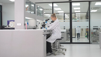 Scientist examines samples in modern laboratory setting during working hours