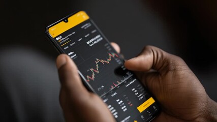 Trading activity in financial markets using a smartphone at home while analyzing real-time data - Powered by Adobe