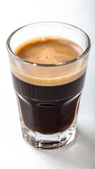Freshly brewed espresso coffee served in a transparent glass cup on white background, high-resolution close-up with visible crema.
