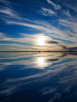 Vertical landscape photography of Salar de Uyuni with mirror effect., sunset.
