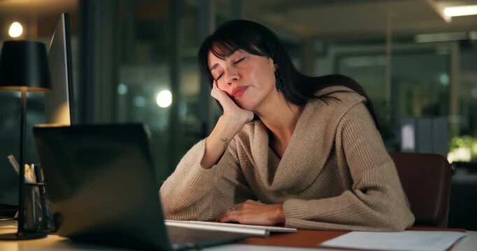 Business woman, laptop and tired in night office for editing, deadline and journalist website glitch. Fatigue, technology and bored girl with overtime strain, creative block and frustrated for report