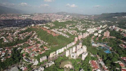 Panning drone of Santa Paula neighborhood showing rooftops and urban pattern