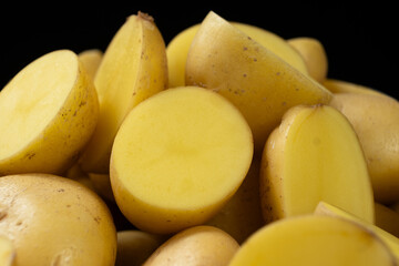 Halves of raw potatoes close-up. Fresh organic vegetables
