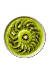 A vibrant green smoothie bowl topped with perfectly arranged kiwi slices and black chia seeds, isolated on a transparent background