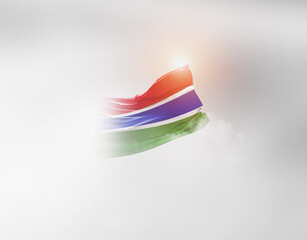 The Gambia flag waving light background hidden in the sky.