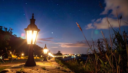 Night landscape with lit pathway lanterns