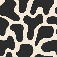 Seamless pattern with cow spots in a stylish, modern black and white color palette