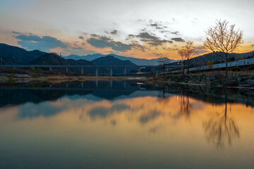 Sunset reflection over river and mountains in Donghae, Korea