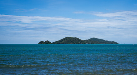Beautiful blue sea and sky viewpoint from Luklom Beach, Samae San Island, Sattahip, Chonburi, Thailand. Scenic tropical seascape with crystal water, horizon, and serene travel destination.
