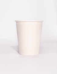 white paper cup and n white background