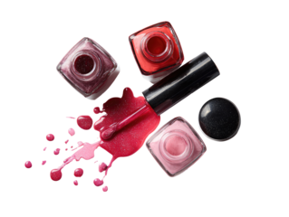 Assorted nail polish bottles and spills