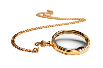 Antique gold pocket watch with chain on a dark surface