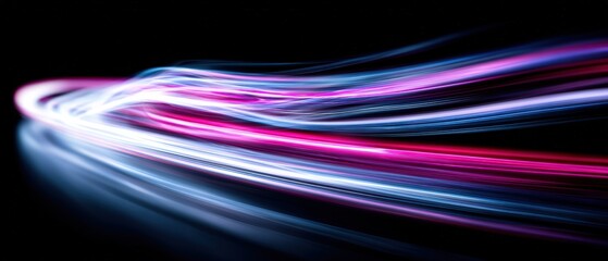 Vibrant Light Trails in Motion Creating Dynamic Abstract Background with Bright Neon Colors and Long Exposure Effect