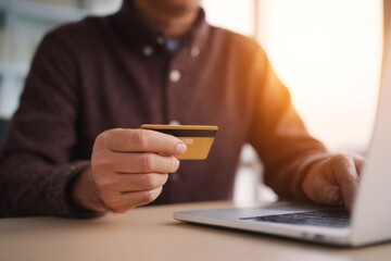 Mysterious golden hour purchase as a South Asian male holds a credit card, embracing Cyber Monday's digital allure